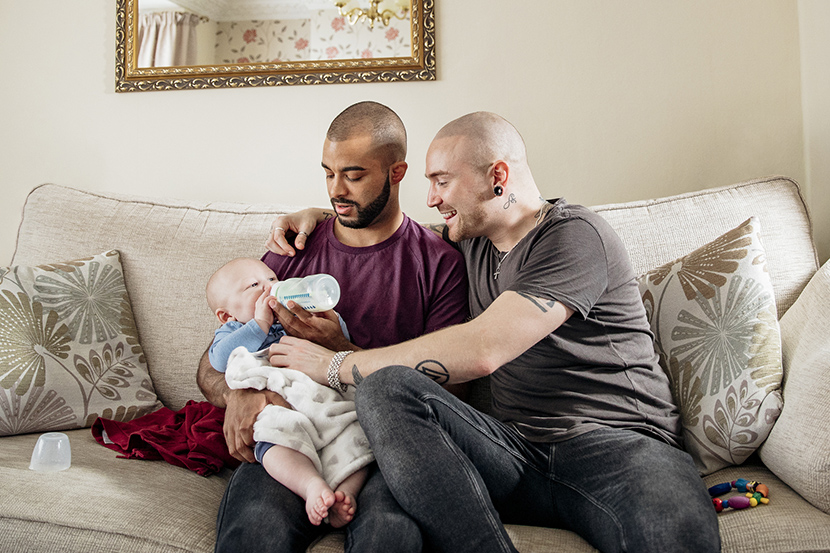 Parents feeding their baby a bottle