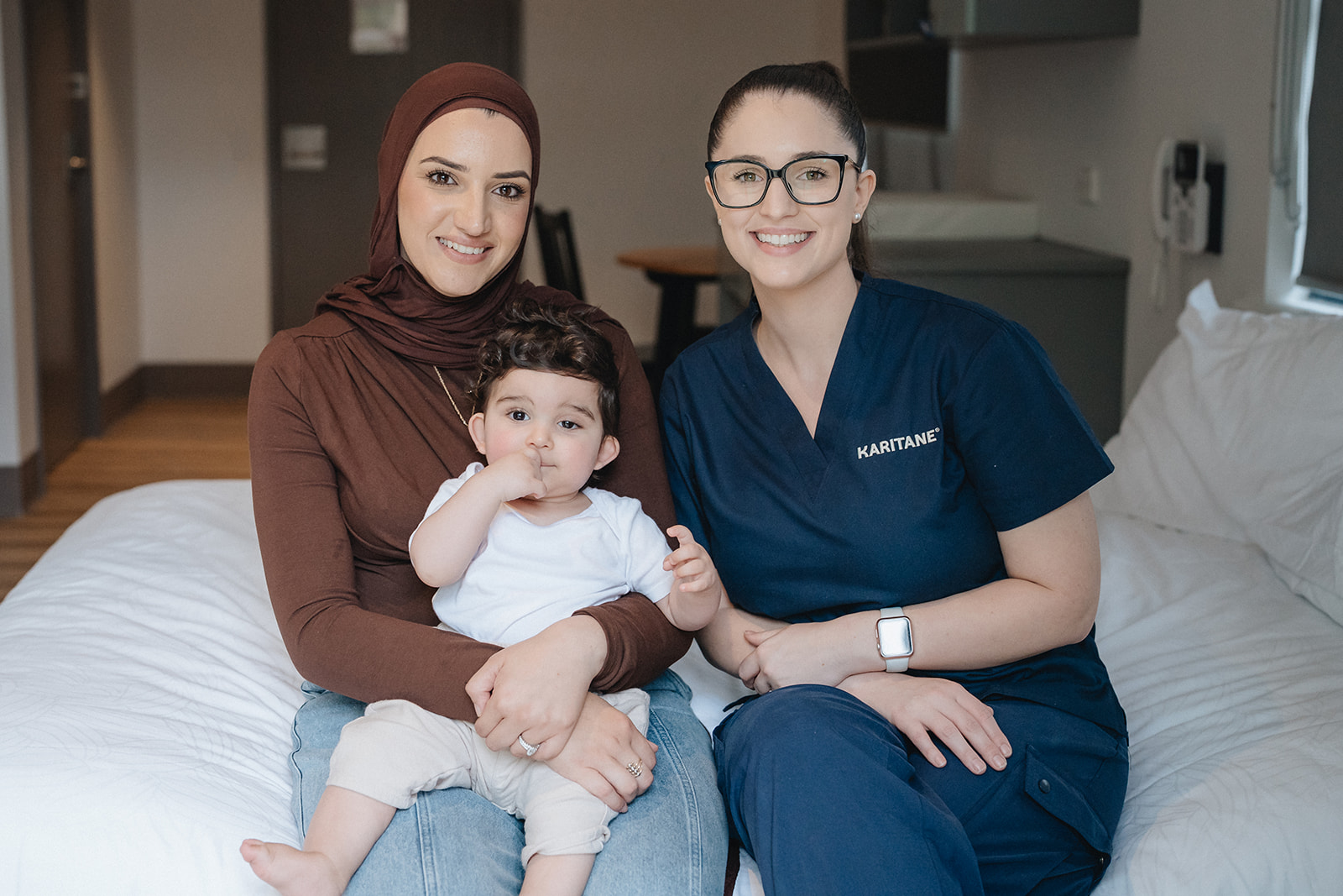 A Karitane Nurse with a mother and baby